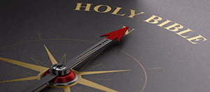 Compass graphic pointing to the words Holy Bible